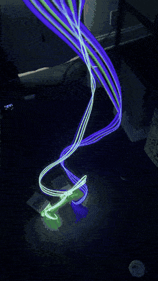 Trippy Wire swung through the air leaving continuous ribbons of blue and green light.