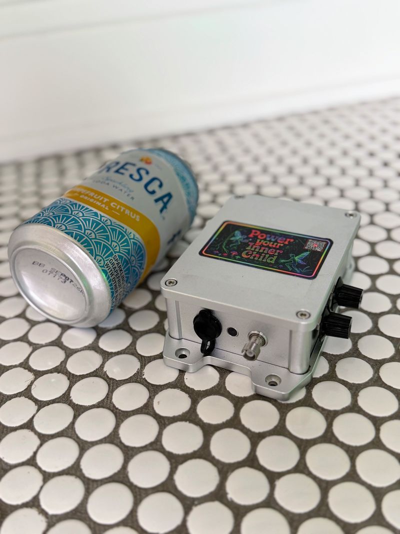The illuminator next to a 12 oz can for scale.